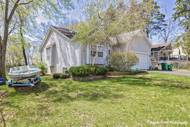 view of front of house with a garage and a front yard