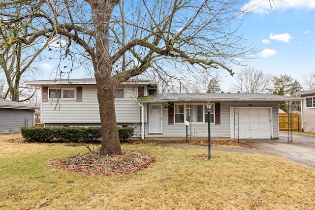 view of front of home with a carport, a garage, and a front yard