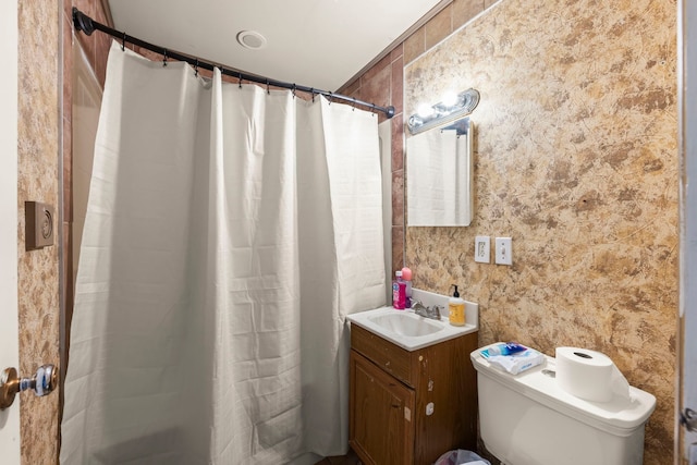 bathroom with vanity, toilet, and a shower with shower curtain