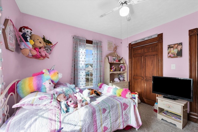 bedroom featuring ceiling fan and carpet floors