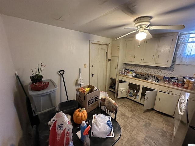 kitchen with ceiling fan, decorative backsplash, and white cabinets