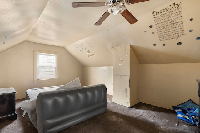 additional living space featuring ceiling fan, lofted ceiling, and dark carpet