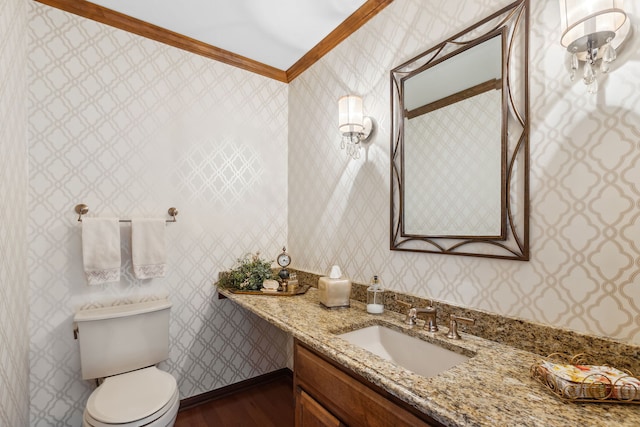 bathroom with vanity, hardwood / wood-style flooring, ornamental molding, and toilet