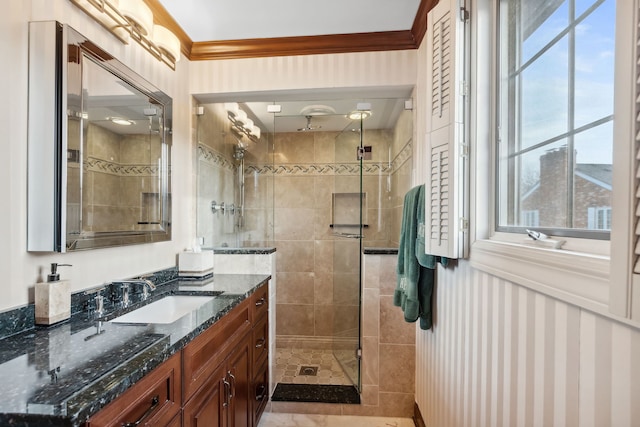 bathroom with ornamental molding, an enclosed shower, and vanity