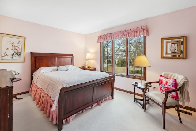 bedroom featuring light colored carpet