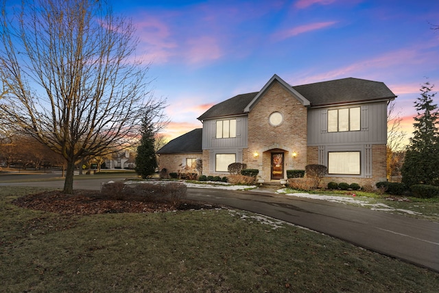 view of front of property with a yard