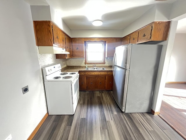 kitchen with sink, stainless steel fridge, white range with electric cooktop, backsplash, and dark hardwood / wood-style floors