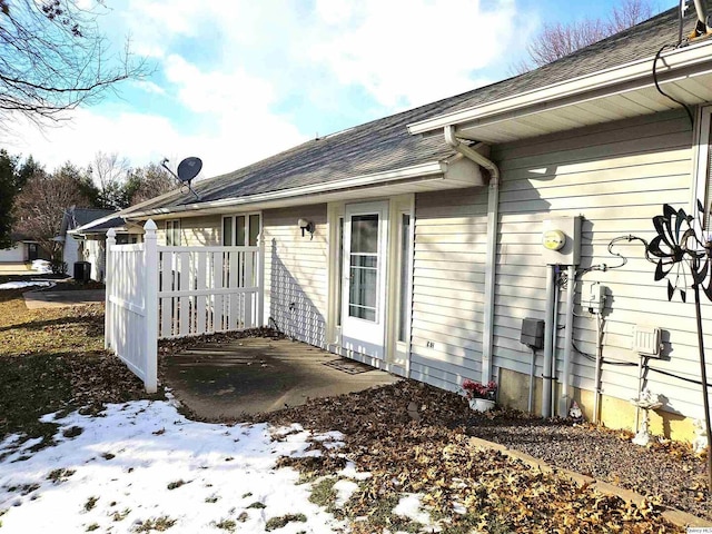 view of snowy exterior featuring a patio