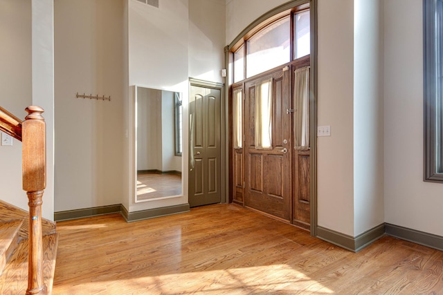 entryway with light hardwood / wood-style floors