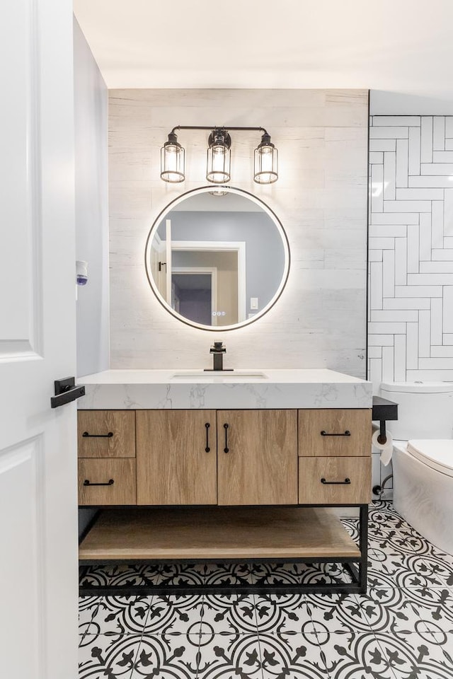 bathroom with vanity, tile patterned floors, and toilet