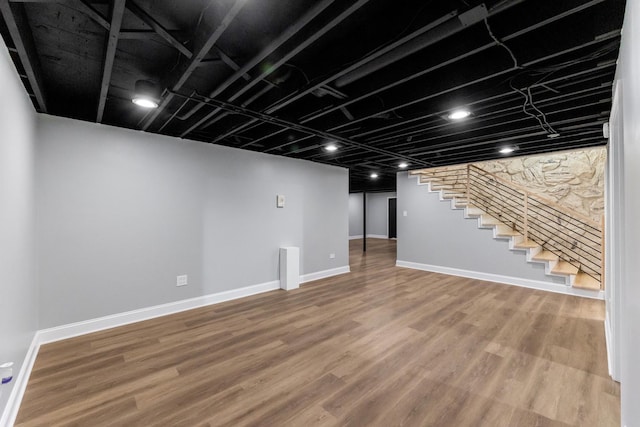 basement featuring hardwood / wood-style flooring