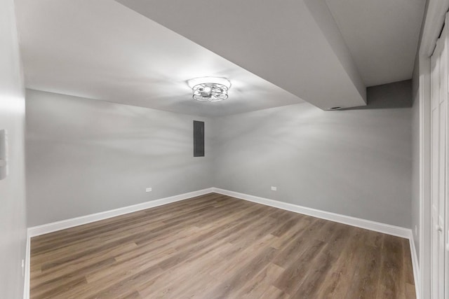 empty room with hardwood / wood-style flooring