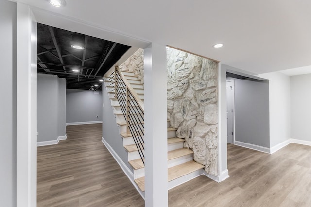 stairway featuring hardwood / wood-style flooring