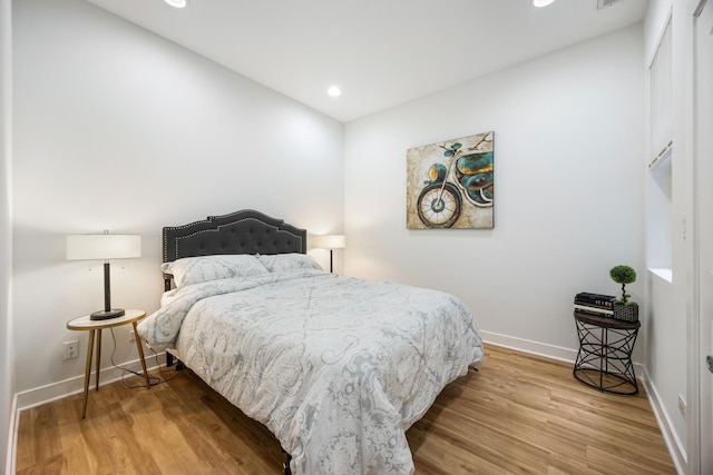 bedroom with wood-type flooring