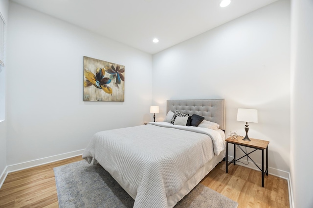 bedroom with hardwood / wood-style floors