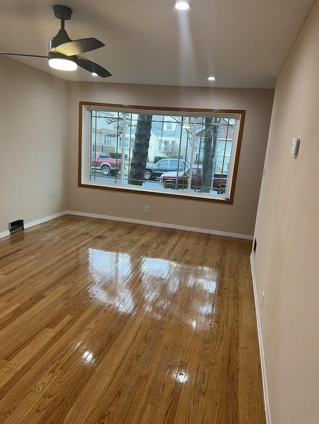 unfurnished dining area featuring ceiling fan and light wood-type flooring