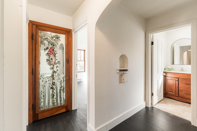 hallway with dark wood-type flooring