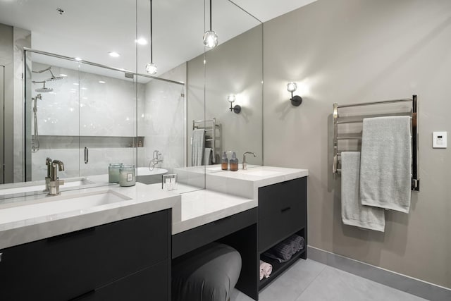 bathroom featuring tile patterned flooring, vanity, and walk in shower