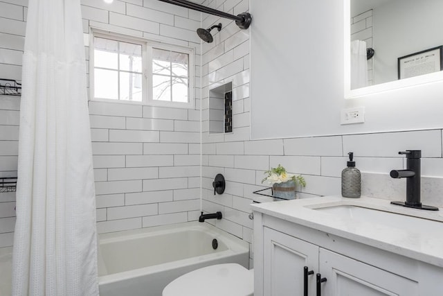 full bathroom with shower / bath combo, vanity, and toilet