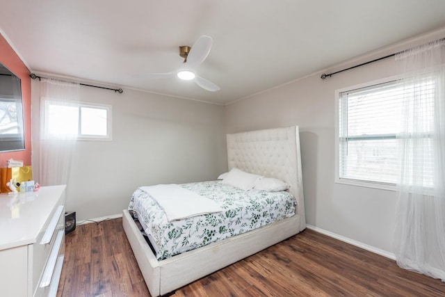 bedroom with dark wood-type flooring and ceiling fan