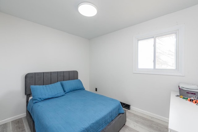 bedroom featuring light hardwood / wood-style floors