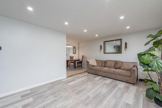 living room with light hardwood / wood-style flooring