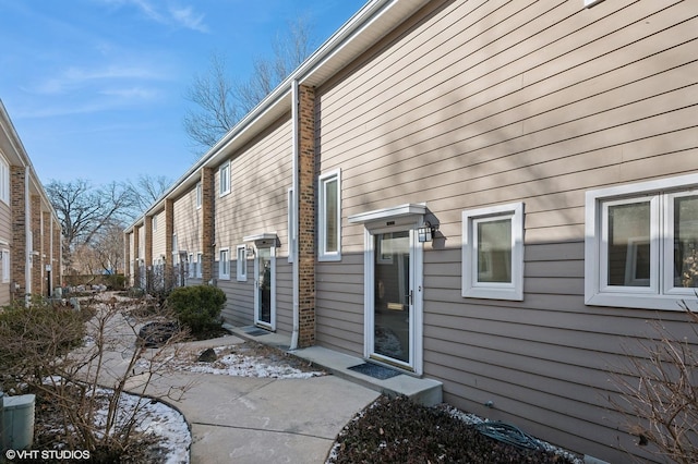 view of side of home with a patio area