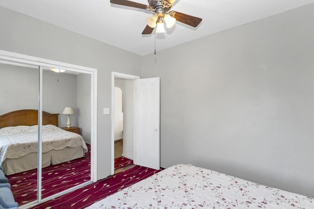 unfurnished bedroom featuring ceiling fan and a closet