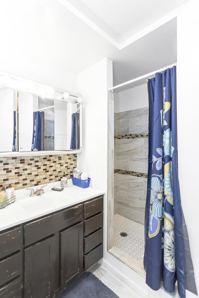 bathroom featuring vanity, curtained shower, and decorative backsplash