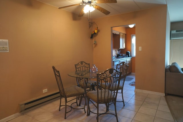 dining space with baseboards, light tile patterned floors, a wall mounted AC, a ceiling fan, and a baseboard radiator