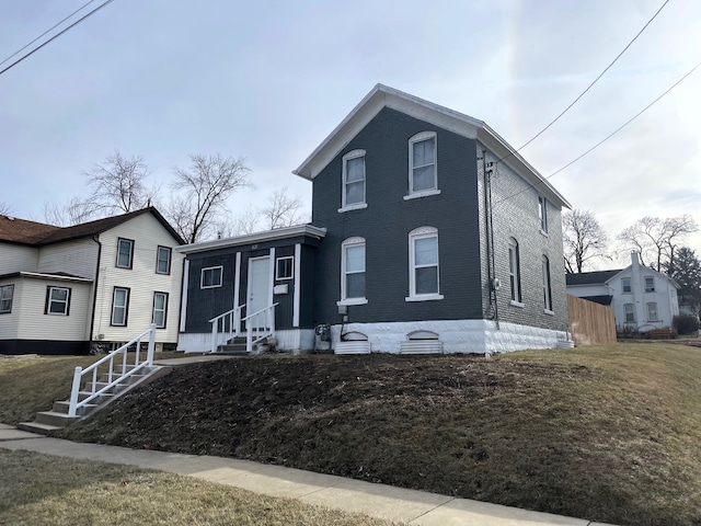 view of front of property with a front lawn