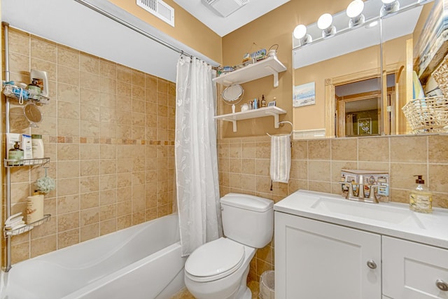 full bathroom featuring tile walls, vanity, toilet, and shower / bathtub combination with curtain