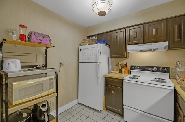 kitchen featuring white appliances, dark brown cabinets, and light tile patterned floors