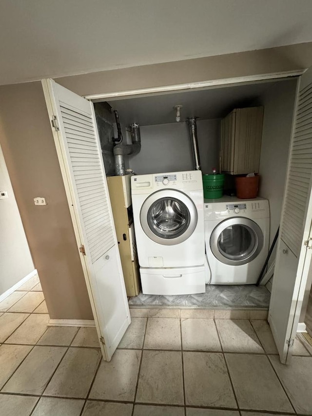 clothes washing area with washing machine and clothes dryer