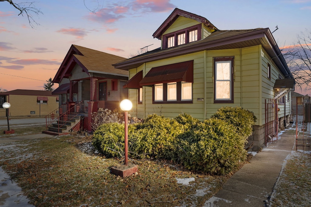 view of property exterior at dusk