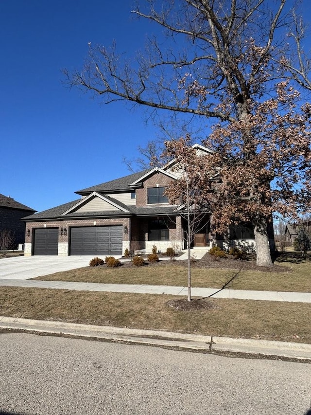 view of front of house with a garage and a front lawn