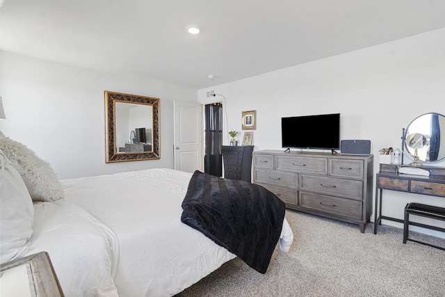 bedroom with light carpet and recessed lighting