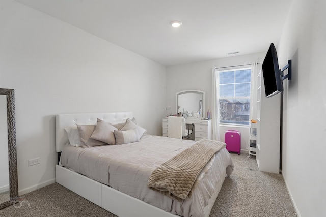 bedroom featuring carpet, visible vents, and baseboards