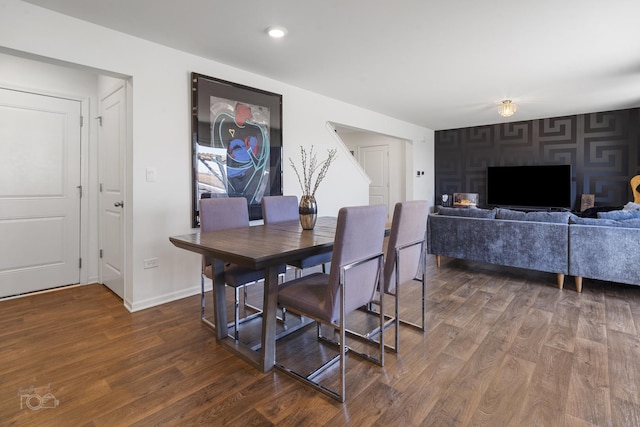 dining space featuring baseboards, dark wood-style flooring, and recessed lighting