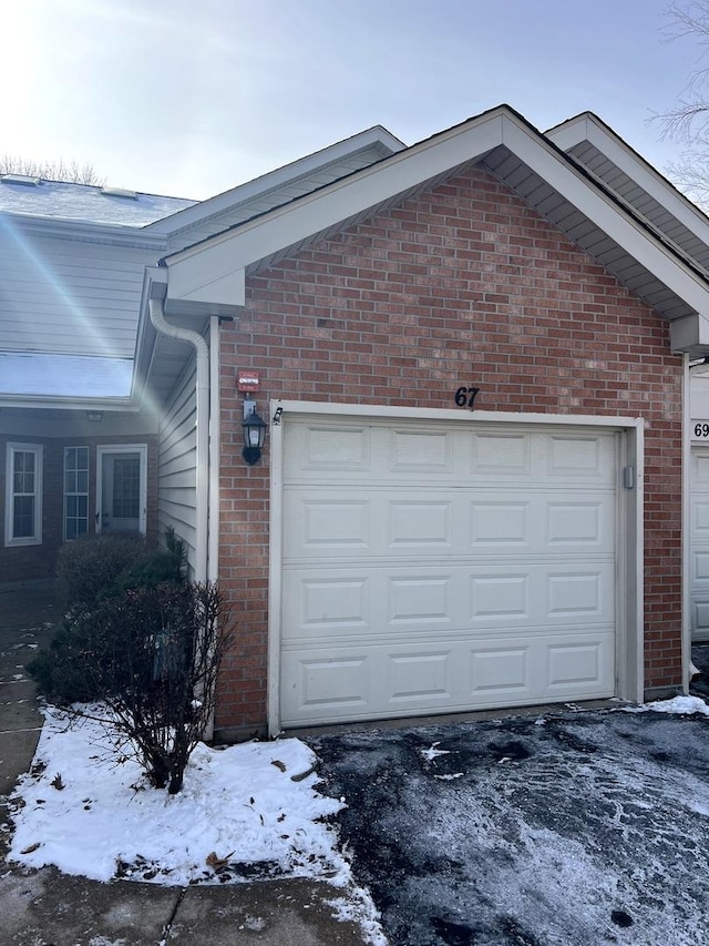 view of snow covered garage