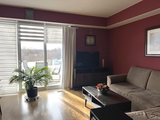 living room with light hardwood / wood-style flooring