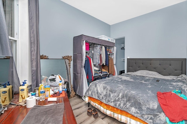 bedroom featuring hardwood / wood-style flooring and a closet