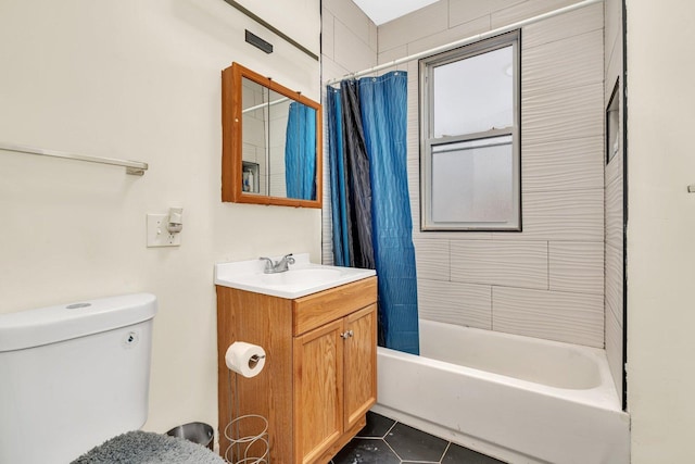 full bathroom with shower / tub combo with curtain, tile patterned floors, toilet, and vanity