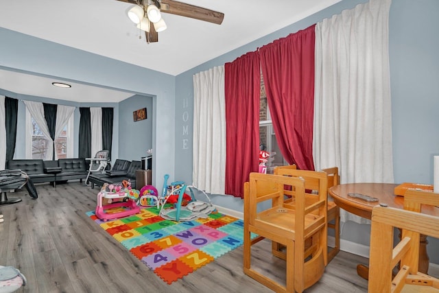 playroom featuring hardwood / wood-style floors and ceiling fan