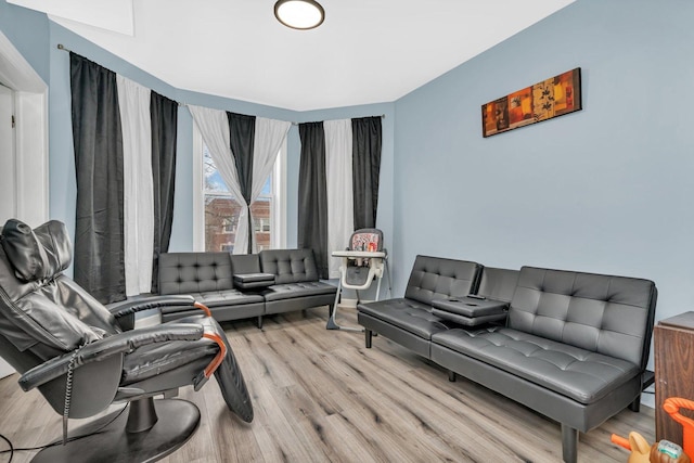 living room with light hardwood / wood-style flooring