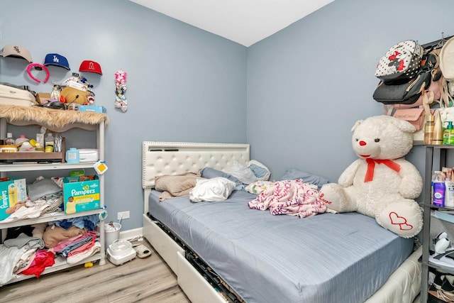 bedroom with wood-type flooring