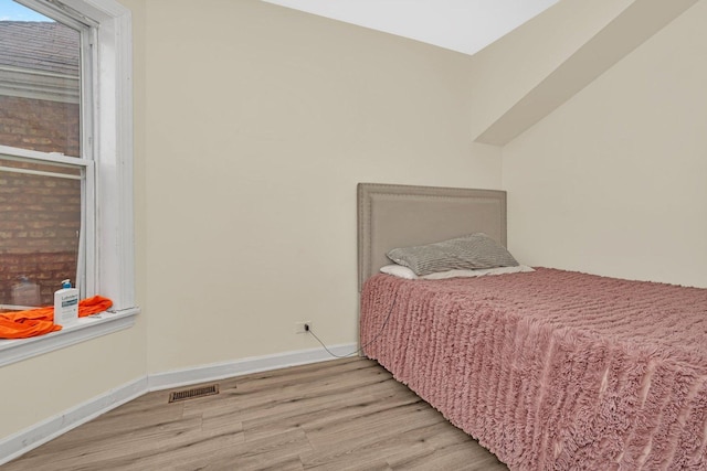 bedroom featuring light wood-type flooring