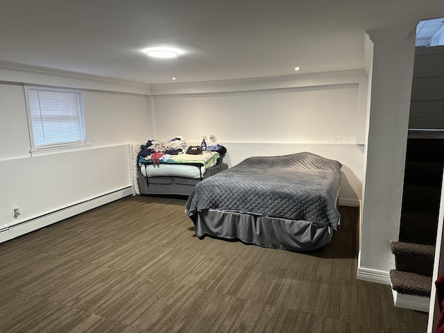carpeted bedroom featuring crown molding and a baseboard radiator