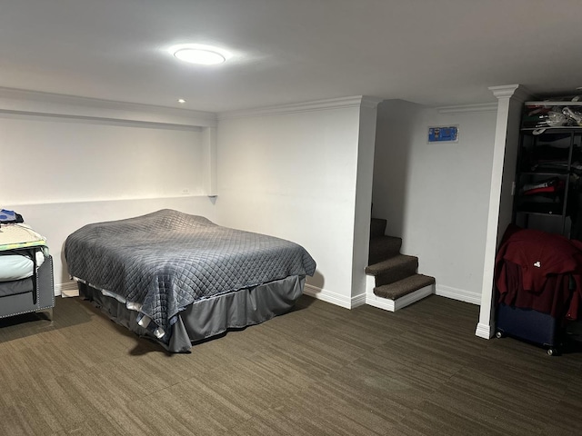 bedroom featuring dark colored carpet