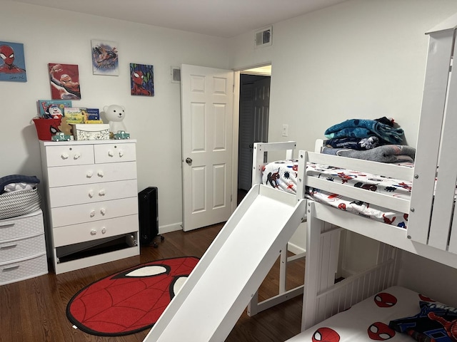 bedroom featuring dark hardwood / wood-style floors